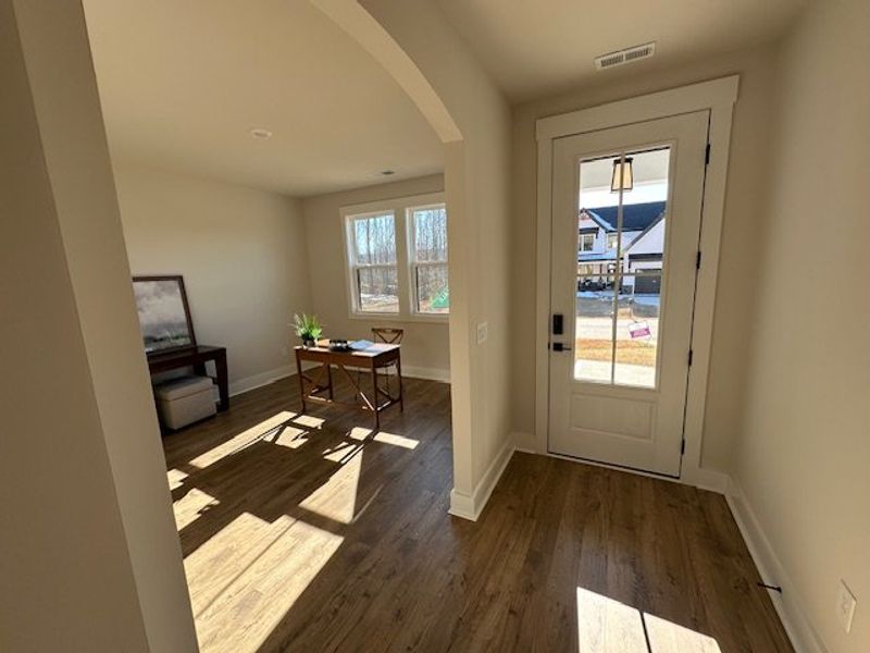 This bright entry opens to a versatile space, perf