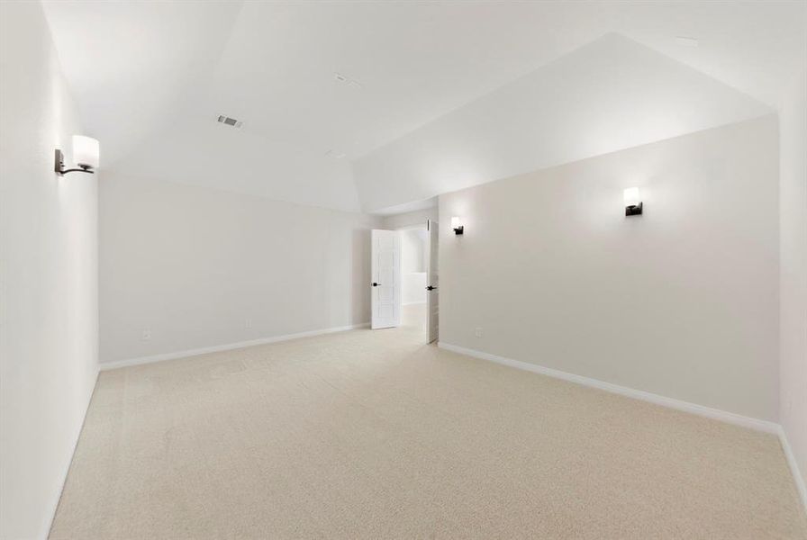 This spacious media room with adjacent game room create the ultimate family entertainment zone!