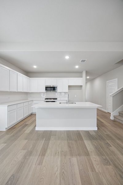 Kitchen in the Stanley II home plan by Trophy Signature Homes – REPRESENTATIVE PHOTO