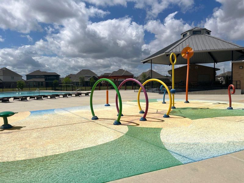 View of the splash pad located next to the community center and pool. View of the splash pad located next to the community center and pool.