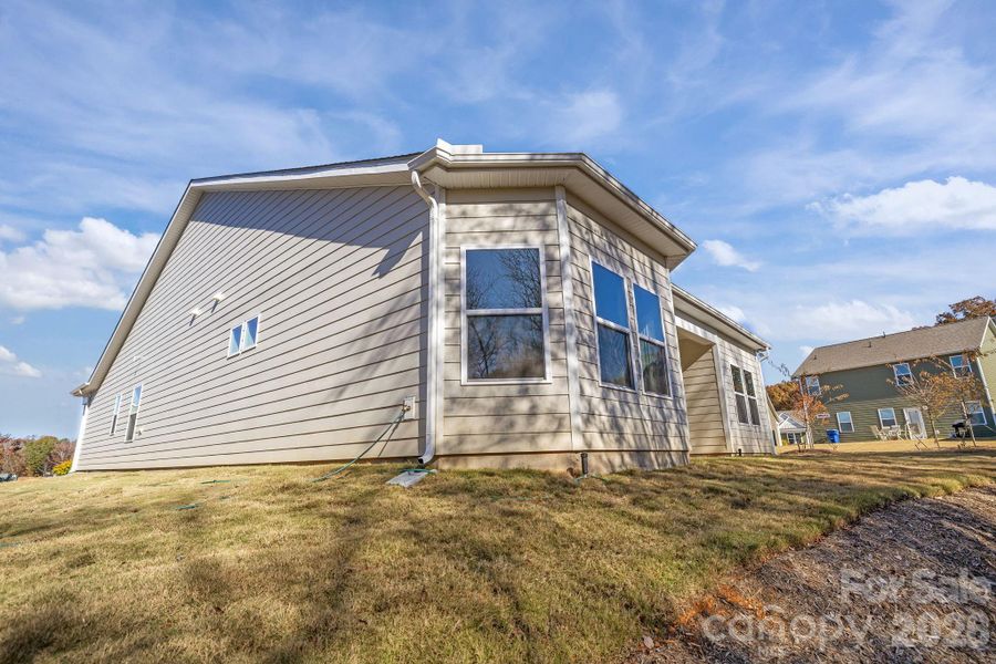 Exterior details and patio area of a home in Cottages at Wingate, Wingate (Image 3). Exterior details and patio area of a home in Cottages at Wingate, Wingate (Image 3).