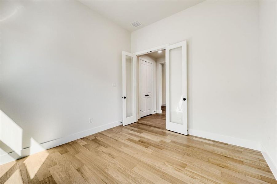 Unfurnished room featuring light wood finished floors