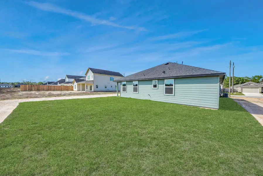 Exterior details and patio area of a home in Hill & Dale Ranch, Splendora (Image 3).
