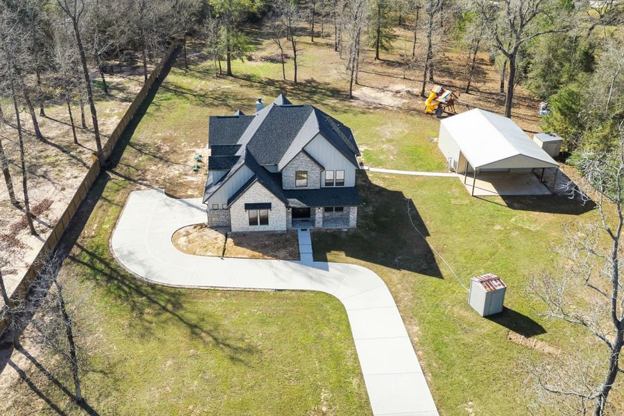 Front exterior of a new home in , Montgomery, TX, highlighting curb appeal (Image 29). Front exterior of a new home in , Montgomery, TX, highlighting curb appeal (Image 29).