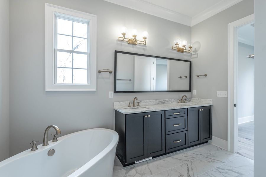 Furnished interior in a model home at Baker Road in Birchwood (Image 18).