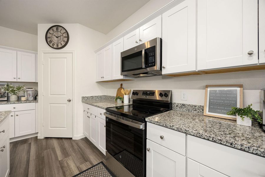 Furnished interior view inside a new home in Sunterra, Katy (Image 13).