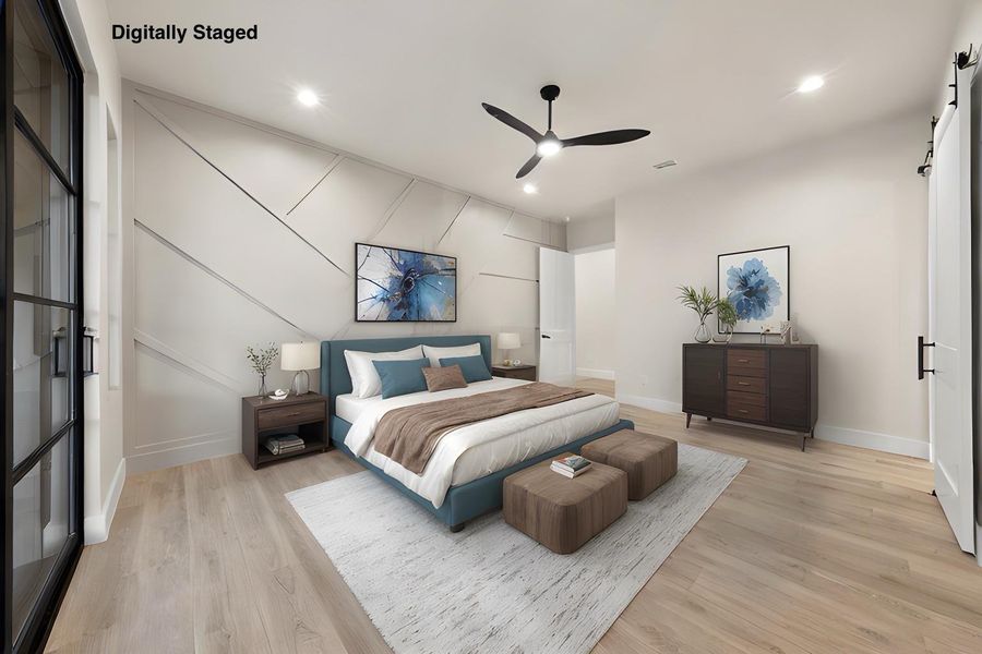 A tranquil bedroom retreat features a statement accent wall and wide plank hardwood flooring.