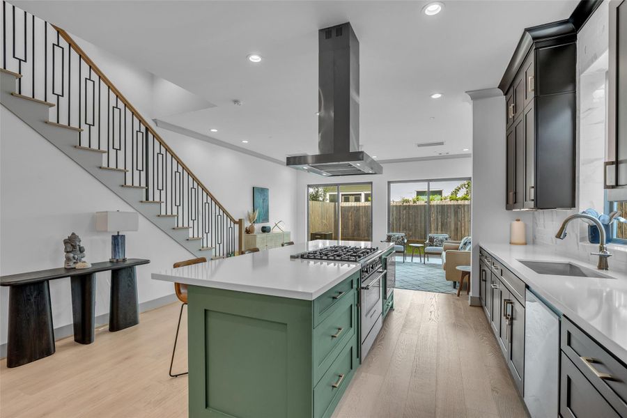 From the kitchen, you have a clear view of the dining area directly across, while the sightline extends through to the backyard, creating an open and connected feel.