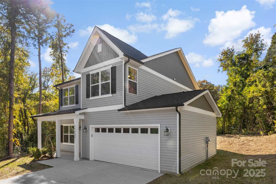 Front exterior of a new home in , Huntersville, NC, highlighting curb appeal (Image 2).