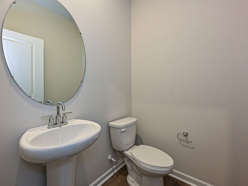 The half bathroom conveniently located near the great room and kitchen for guests.