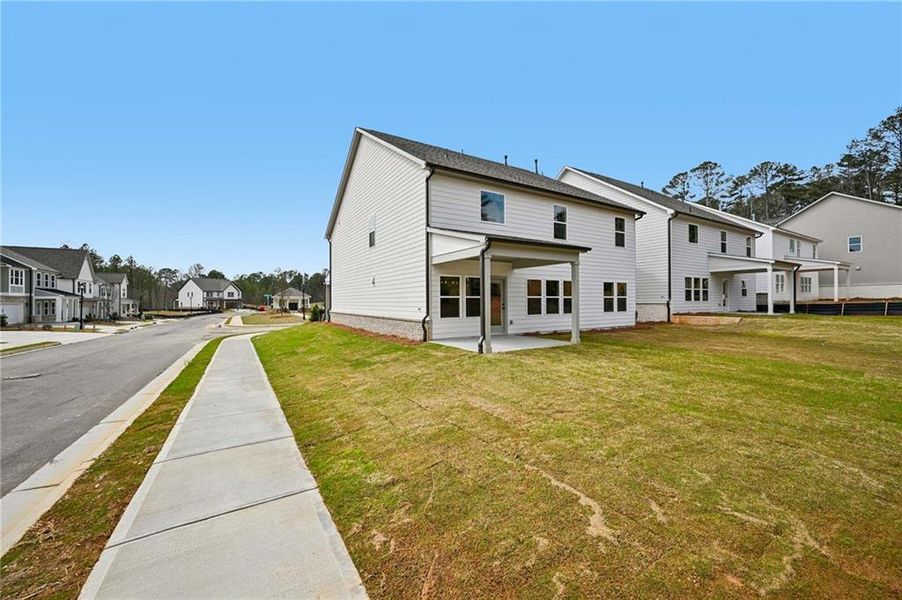 Exterior details and patio area of a home in Arbors at Richland Creek, Buford (Image 16).