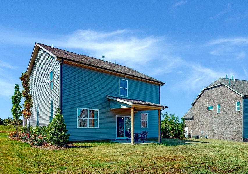 A house with a grass yard. A house with a grass yard.