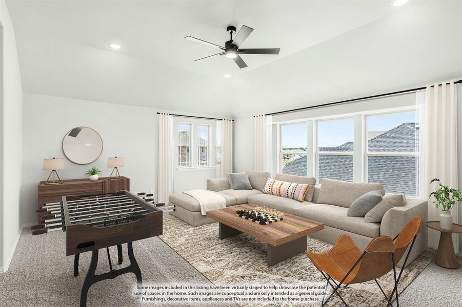 Game room with sectional sofa, foosball table, ceiling fan, and large windows with natural light Game room with sectional sofa, foosball table, ceiling fan, and large windows with natural light