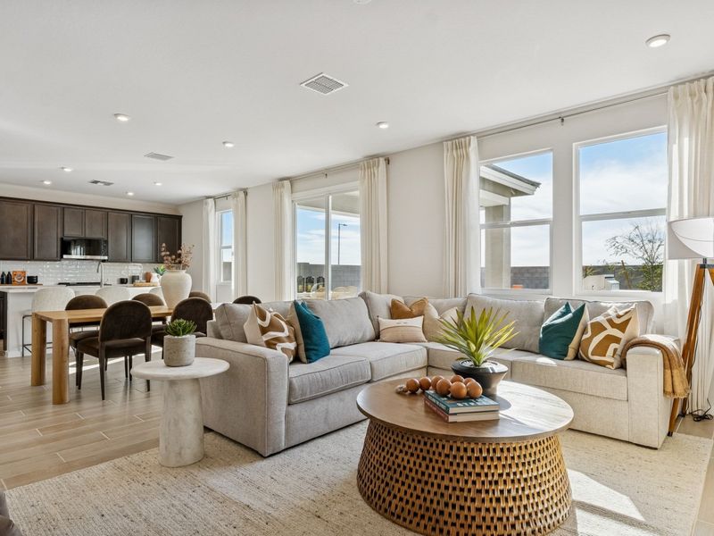 A living room with a large window. A living room with a large window.