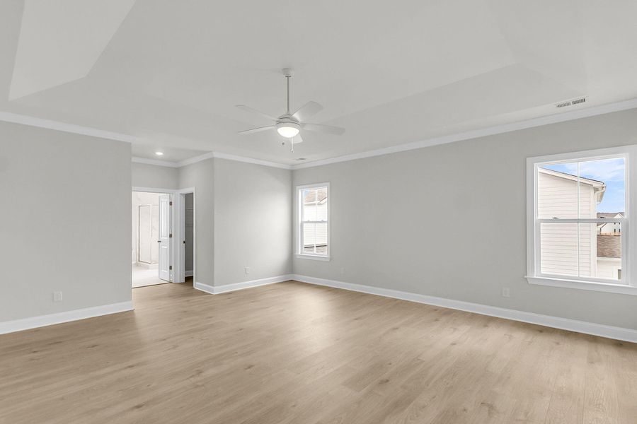 Spacious, unfurnished interior of a new home in Tidewater at Lakes of Cane Bay, Summerville (Image 55).