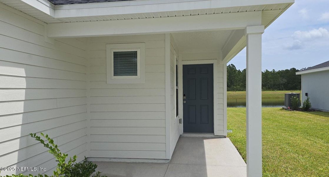 Exterior details and patio area of a home in Flagler Village - Classic Series, Palm Coast (Image 2). Exterior details and patio area of a home in Flagler Village - Classic Series, Palm Coast (Image 2).