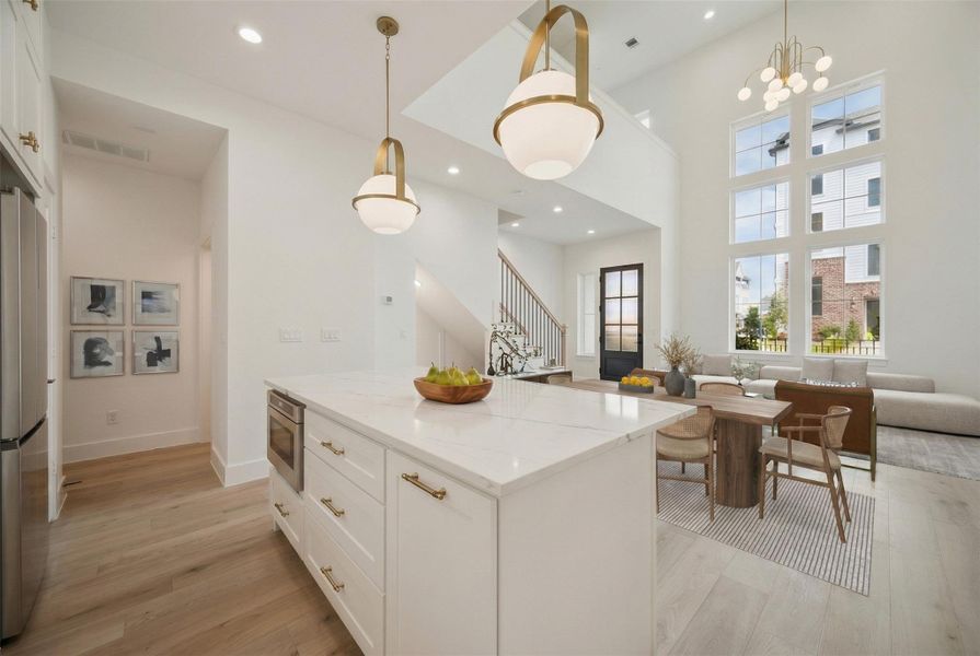 Riverway uses beautiful quartz Kentmore soft clothes, cabinets with gold finishes in this home and beautiful designer lighting.