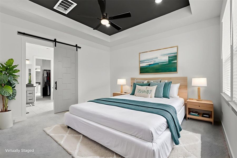 BRIGHT OWNER’S RETREAT FEATURING BARN DOOR ENTRY AND ACCESS TO THE LUXURIOUS ENSUITE BATH. BRIGHT OWNER’S RETREAT FEATURING BARN DOOR ENTRY AND ACCESS TO THE LUXURIOUS ENSUITE BATH.
