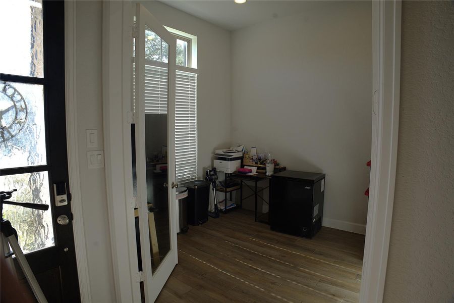 Home office featuring dark wood-style floors and baseboards Home office featuring dark wood-style floors and baseboards
