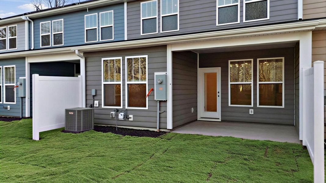 Superior curb appeal continues to the back with a refined, covered outdoor living space