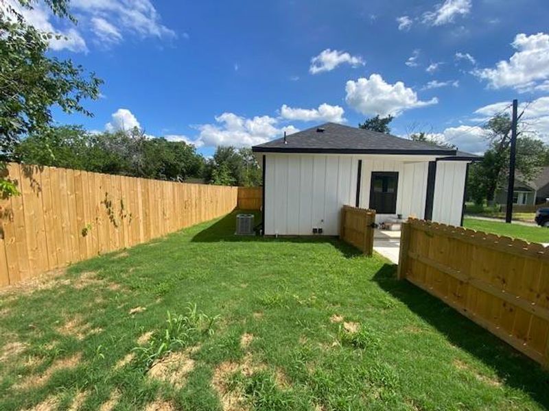 Newly fenced backyard offers a secluded and green outdoor retreat. Newly fenced backyard offers a secluded and green outdoor retreat.