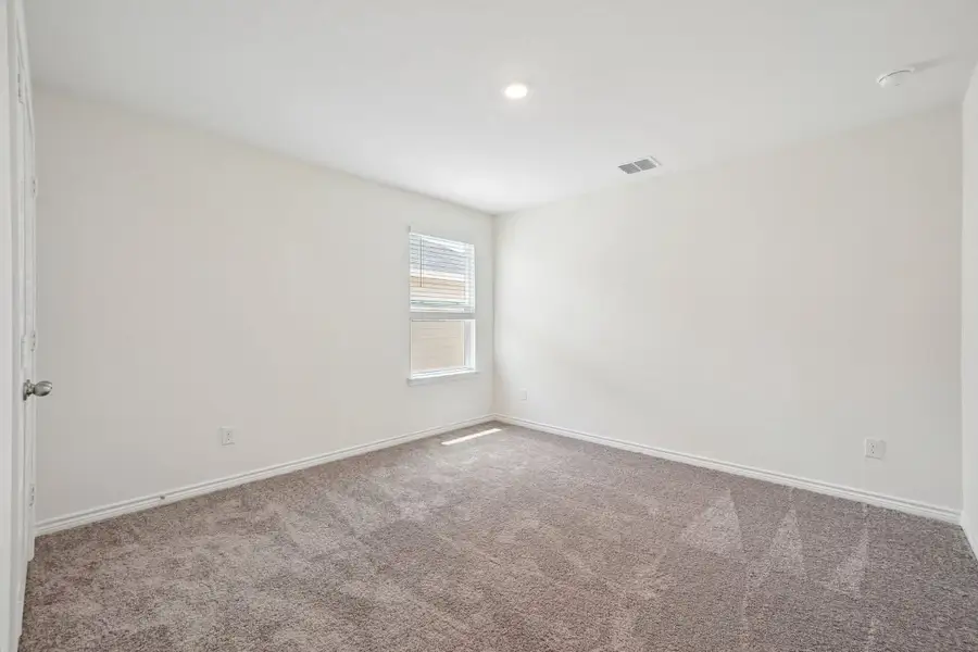 Spacious, unfurnished interior of a new home in Preserve at Culebra - Sterling Collection, San Antonio (Image 26).