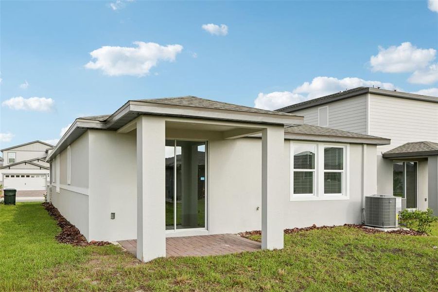 Exterior details and patio area of a home in Springs at Lake Alfred - Classic Series, Lake Alfred (Image 25).