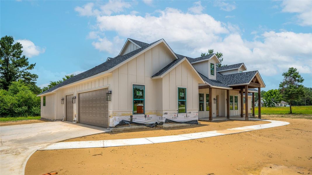 Front exterior of a new home in , Montgomery, TX, highlighting curb appeal (Image 26). Front exterior of a new home in , Montgomery, TX, highlighting curb appeal (Image 26).