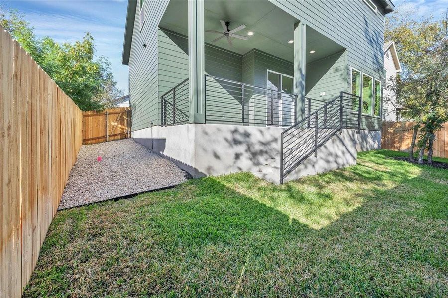 Rear view of  home and  yard. Plenty of space for your furry friends!