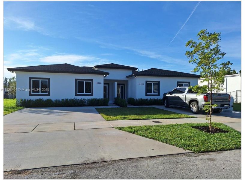 Front exterior of a new home in , Miami, FL, highlighting curb appeal (Image 1).