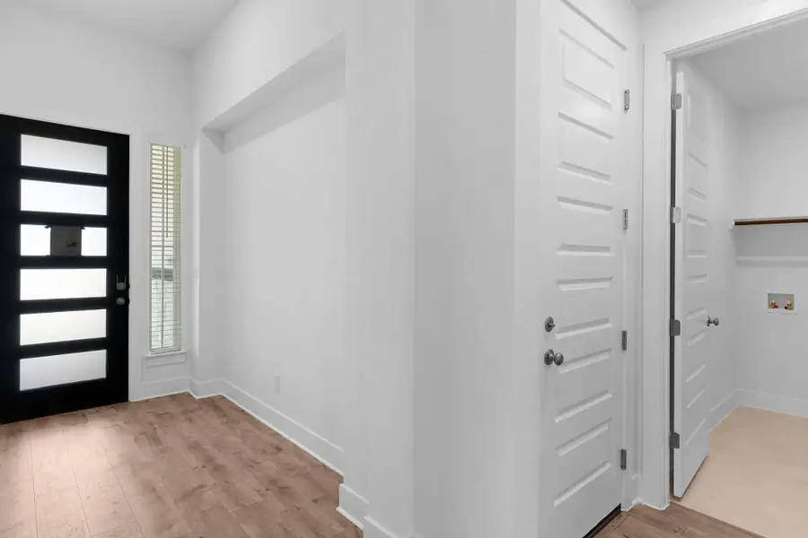 Representative unfurnished interior of a home built from the Lucas by Chesmar Homes in Parkside on the River, Georgetown (Image 6).