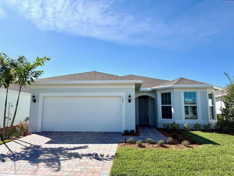 Front exterior of a new home in , Port St. Lucie, FL, highlighting curb appeal (Image 21).