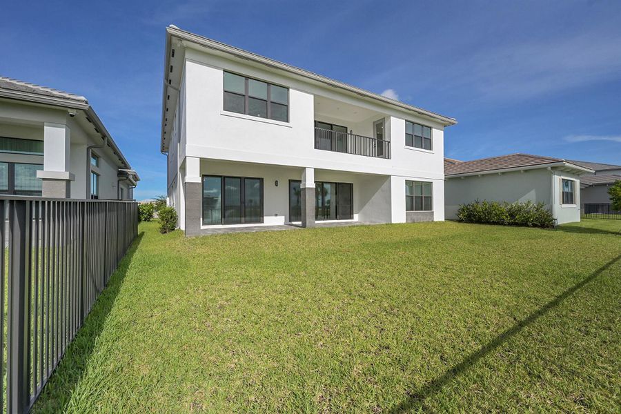 Front exterior of a new home in Apex at Avenir, Palm Beach Gardens, FL, highlighting curb appeal (Image 1).