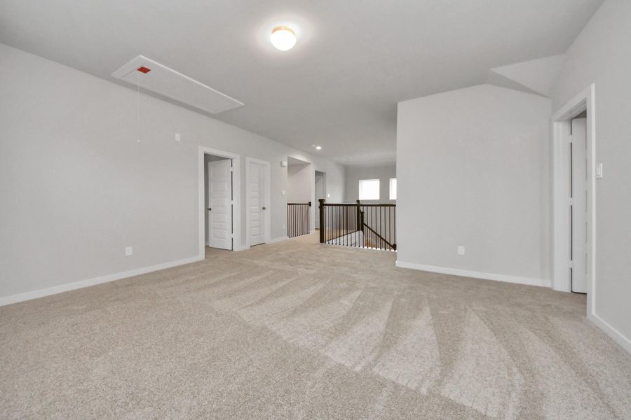 Ascend to relaxation in this fantastic game room! Ideal for both casual gatherings and adultgaming, it boasts plush carpet, lofty ceilings, custom paint, and ample windows for abundantnatural light. Sample photo of completed home with similar floor plan. Actual colors and selections may vary. Ascend to relaxation in this fantastic game room! Ideal for both casual gatherings and adultgaming, it boasts plush carpet, lofty ceilings, custom paint, and ample windows for abundantnatural light. Sample photo of completed home with similar floor plan. Actual colors and selections may vary.