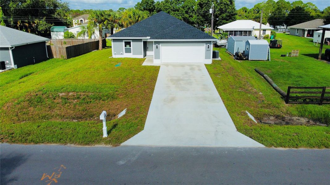 Front exterior of a new home in , Okeechobee, FL, highlighting curb appeal (Image 1).