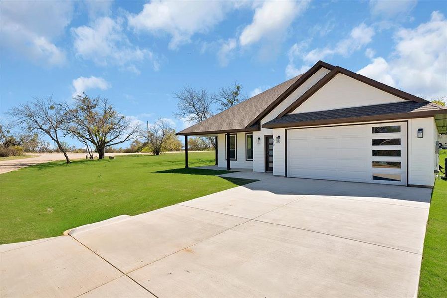 Front exterior of a new home in , Runaway Bay, TX, highlighting curb appeal (Image 17).