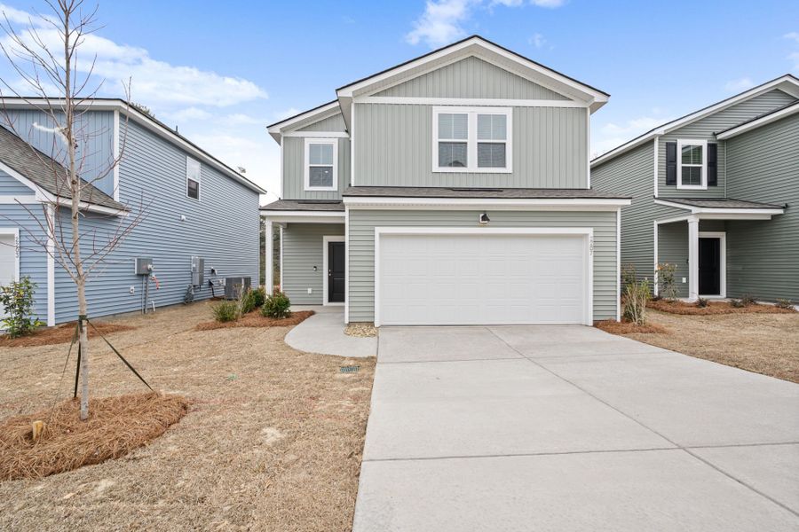 Front exterior of a new home in Grand Arbor, Blythewood, SC, highlighting curb appeal (Image 21). Front exterior of a new home in Grand Arbor, Blythewood, SC, highlighting curb appeal (Image 21).