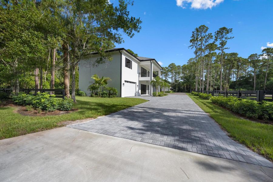 Front exterior of a new home in , Wellington, FL, highlighting curb appeal (Image 35).