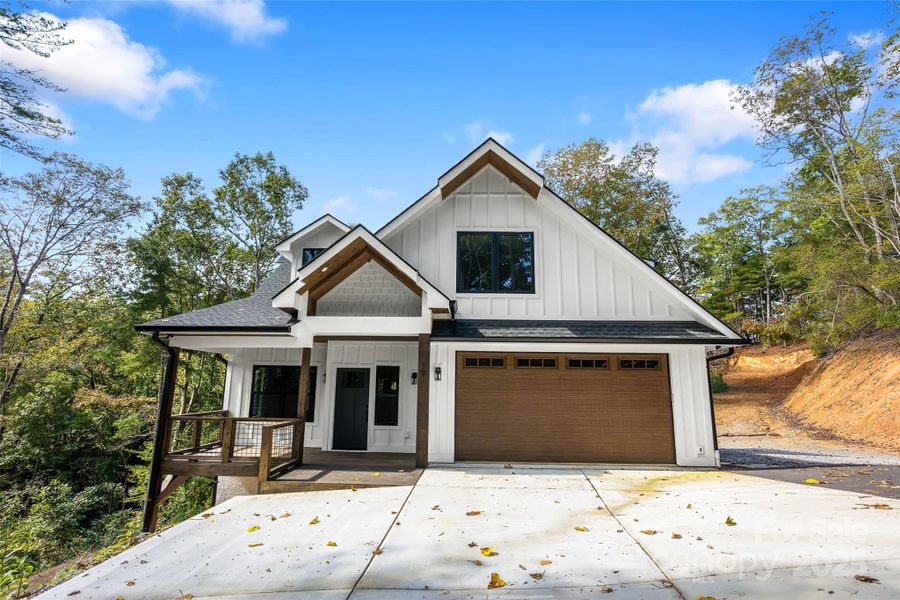 Front exterior of a new home in , Horse Shoe, NC, highlighting curb appeal (Image 1).