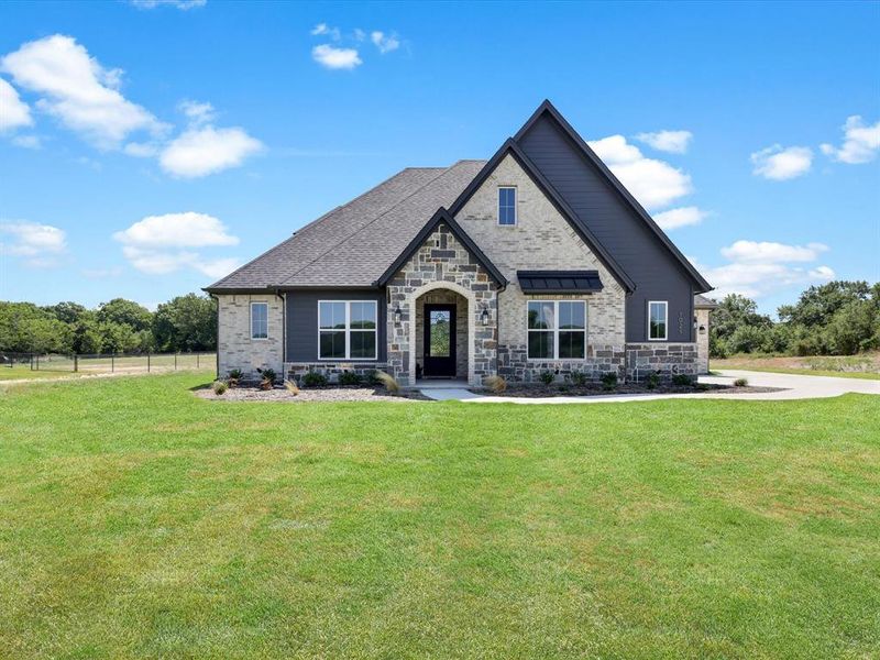 Front exterior of a new home in Silver Sage Farm, Weatherford, TX, highlighting curb appeal (Image 1). Front exterior of a new home in Silver Sage Farm, Weatherford, TX, highlighting curb appeal (Image 1).