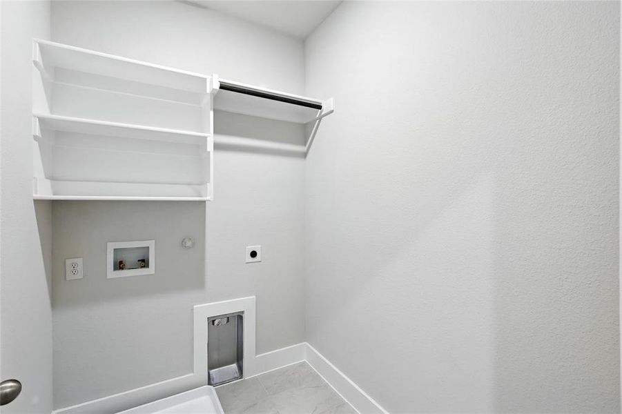 Laundry area with gas dryer hookup, hookup for an electric dryer, and washer hookup