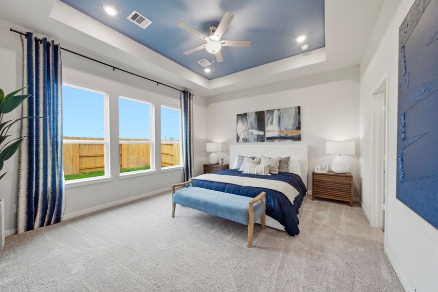 A bedroom with a bed and a window. A bedroom with a bed and a window.