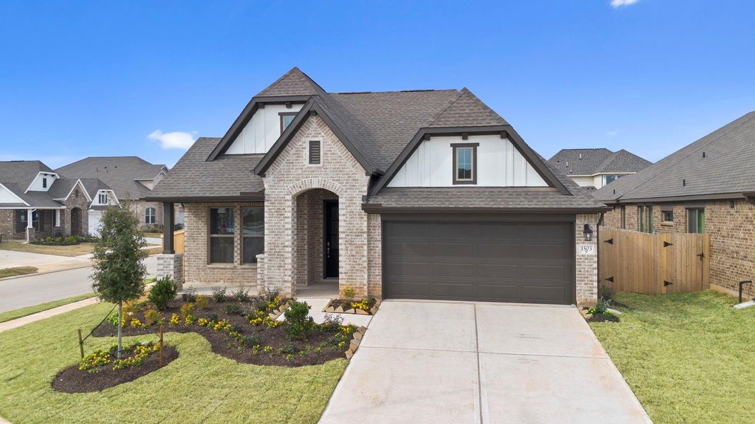 Front exterior of a new home in Escondido, Magnolia, TX, highlighting curb appeal (Image 20).