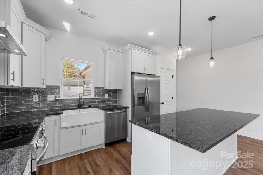 kitchen complete w/ a pantry, porcelain white farmhouse sink & a hood vent! *dishwasher & fridge included kitchen complete w/ a pantry, porcelain white farmhouse sink & a hood vent! *dishwasher & fridge included