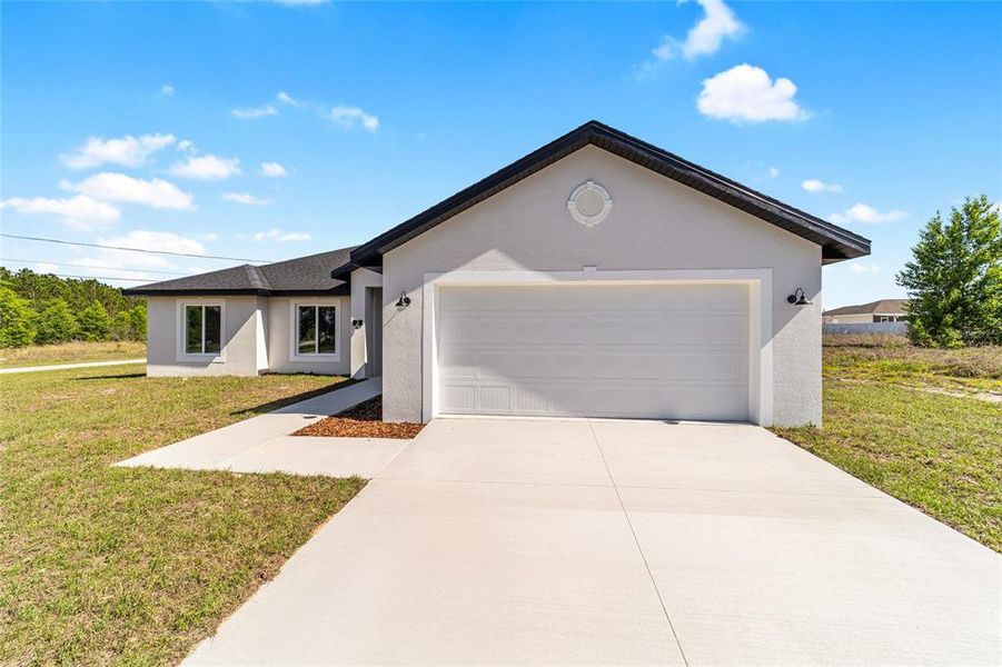 Front exterior of a new home in , Ocala, FL, highlighting curb appeal (Image 26).
