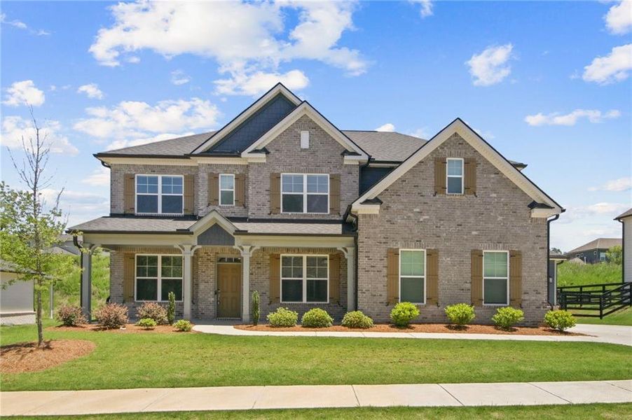 Front exterior of a new home in Carmichael Farms, Canton, GA, highlighting curb appeal (Image 1). Front exterior of a new home in Carmichael Farms, Canton, GA, highlighting curb appeal (Image 1).