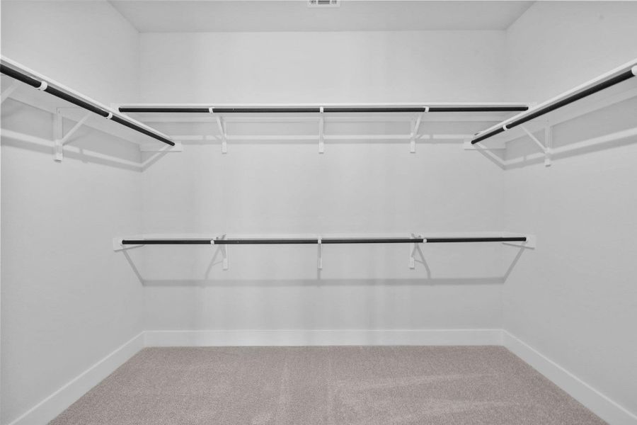 Walk-in closet in Primary Bedroom Walk-in closet in Primary Bedroom