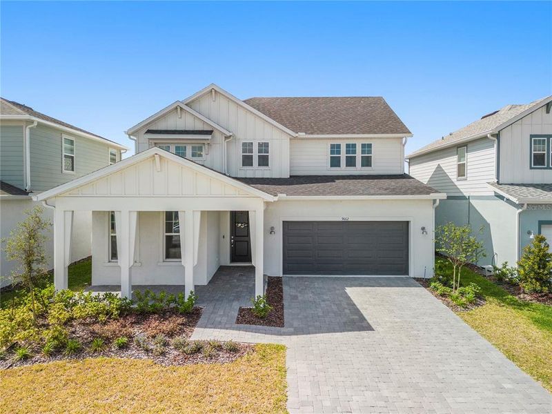 Front exterior of a new home in , Orlando, FL, highlighting curb appeal (Image 23).