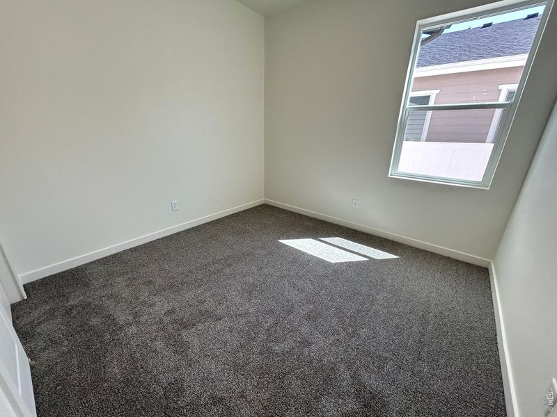 Spacious, unfurnished interior of a new home in Union Colony West, Greeley (Image 8).