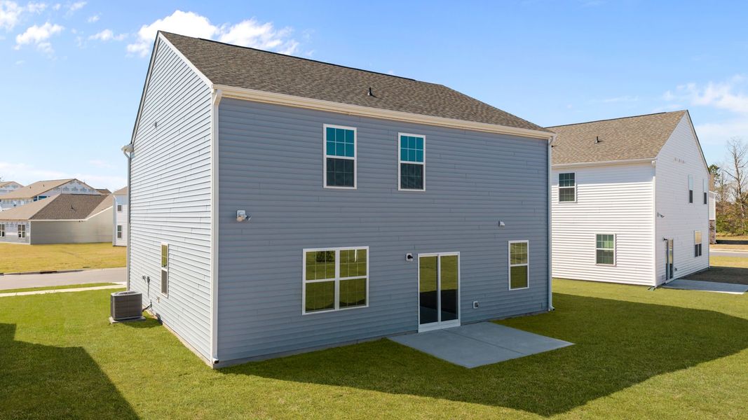 Exterior details and patio area of a home in Ridgewood Farms, Winterville (Image 14).